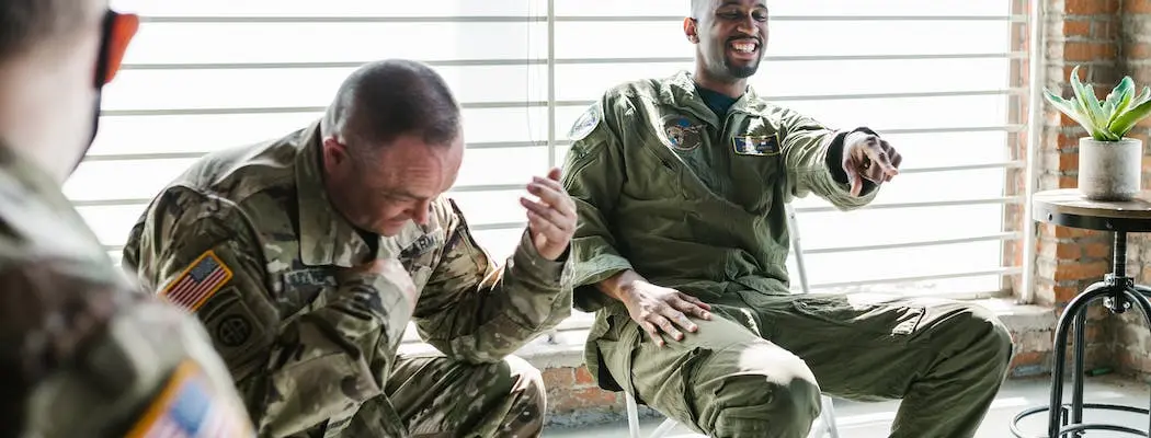 People talking during veteran PTSD and substance abuse group therapy