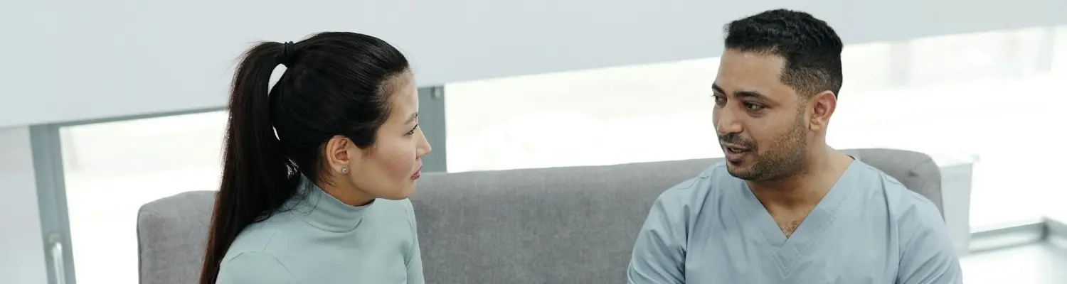 A person consulting a doctor about breastfeeding and oxycodone