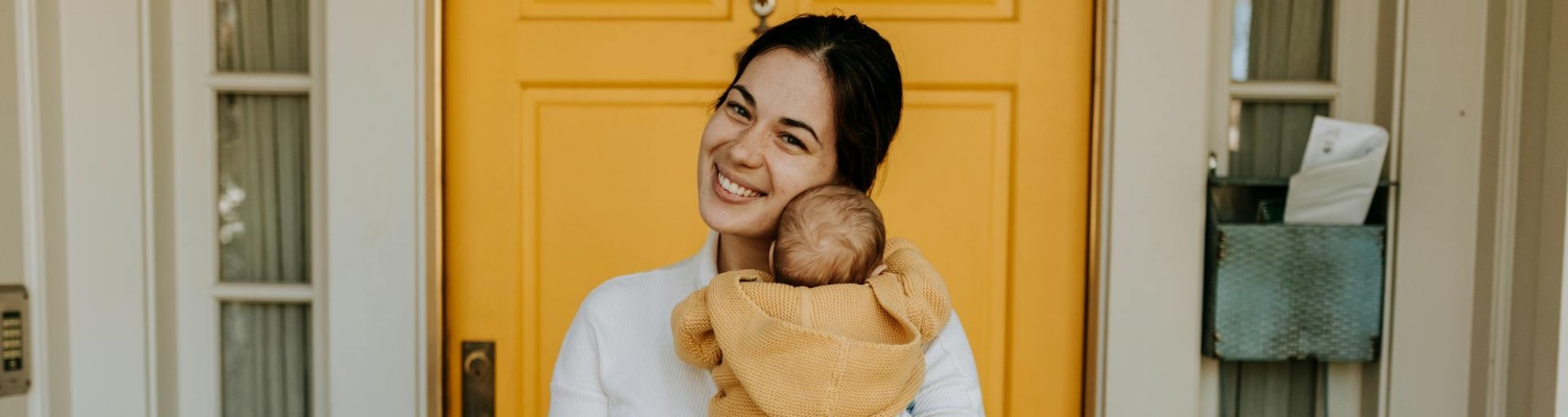 A happy mom hugging her baby after solving the problem of oxycodone and breastfeeding