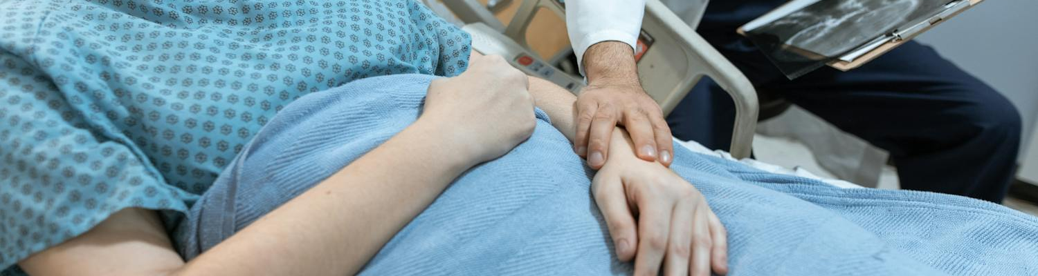 A patient lying in a hospital bed representing crack addict detoxification process. 