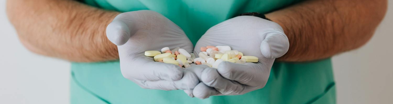 A doctor holding medications used at an alcohol detox center