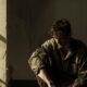 sad man slouched against a wall, sitting on the floor in dim light cocaine addiction